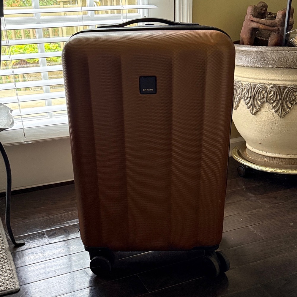 Skyline copper Hardside Suitcase with Spinner wheels.